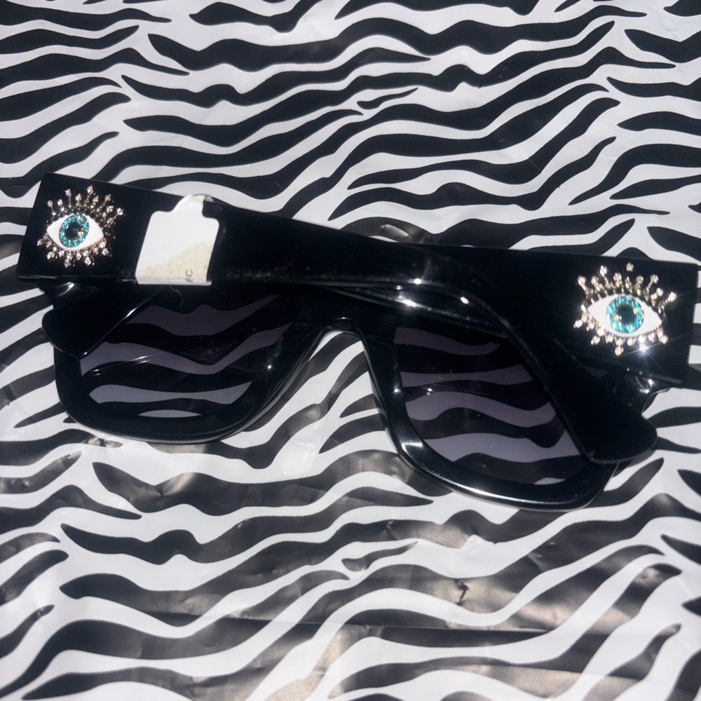 Kurt Geiger Black Sunglasses with Eye Details